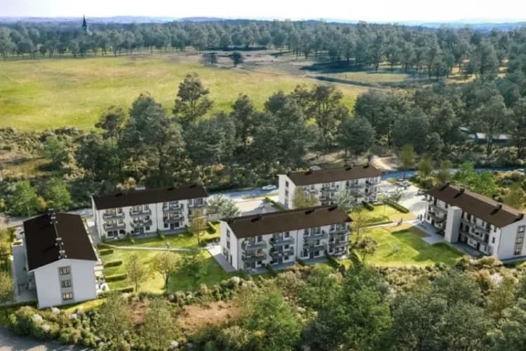 Falkenberg, moderna byggnader omgivna av grönska och träd.