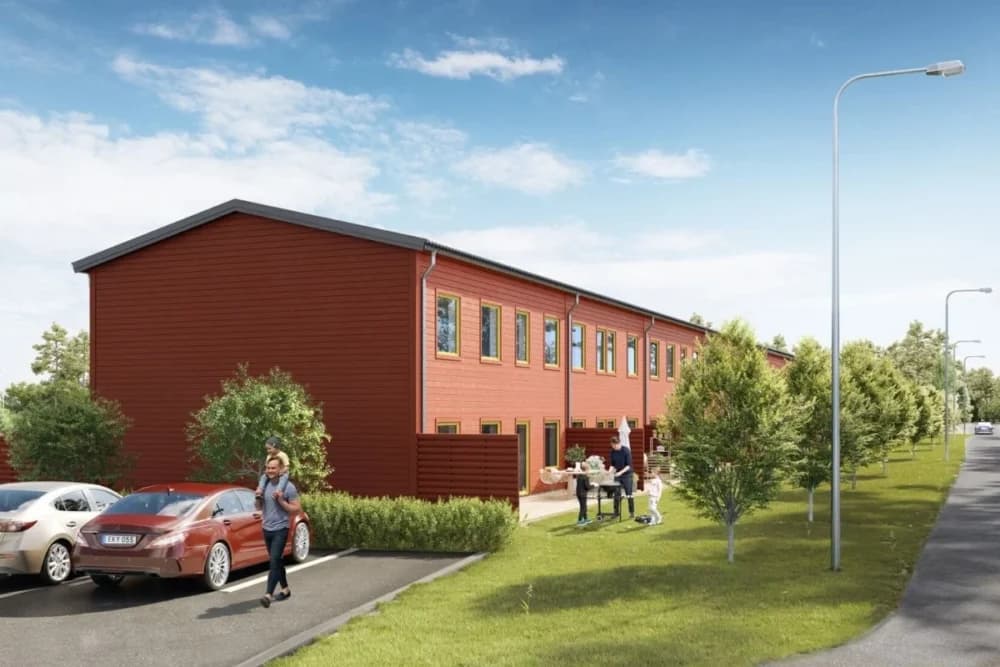 Radhus i Öland med människor som umgås utomhus.